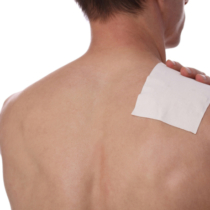 Medicated pain relief patch, plaster. man with back, neck pain. Pain relief and health care concept isolated on white.