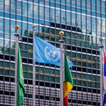 NEW YORK, USA - December 08, 2016: World and UN Flags in front  at United Nations Headquarters in Manhattan