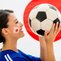 Football fan from Japan holding a ball